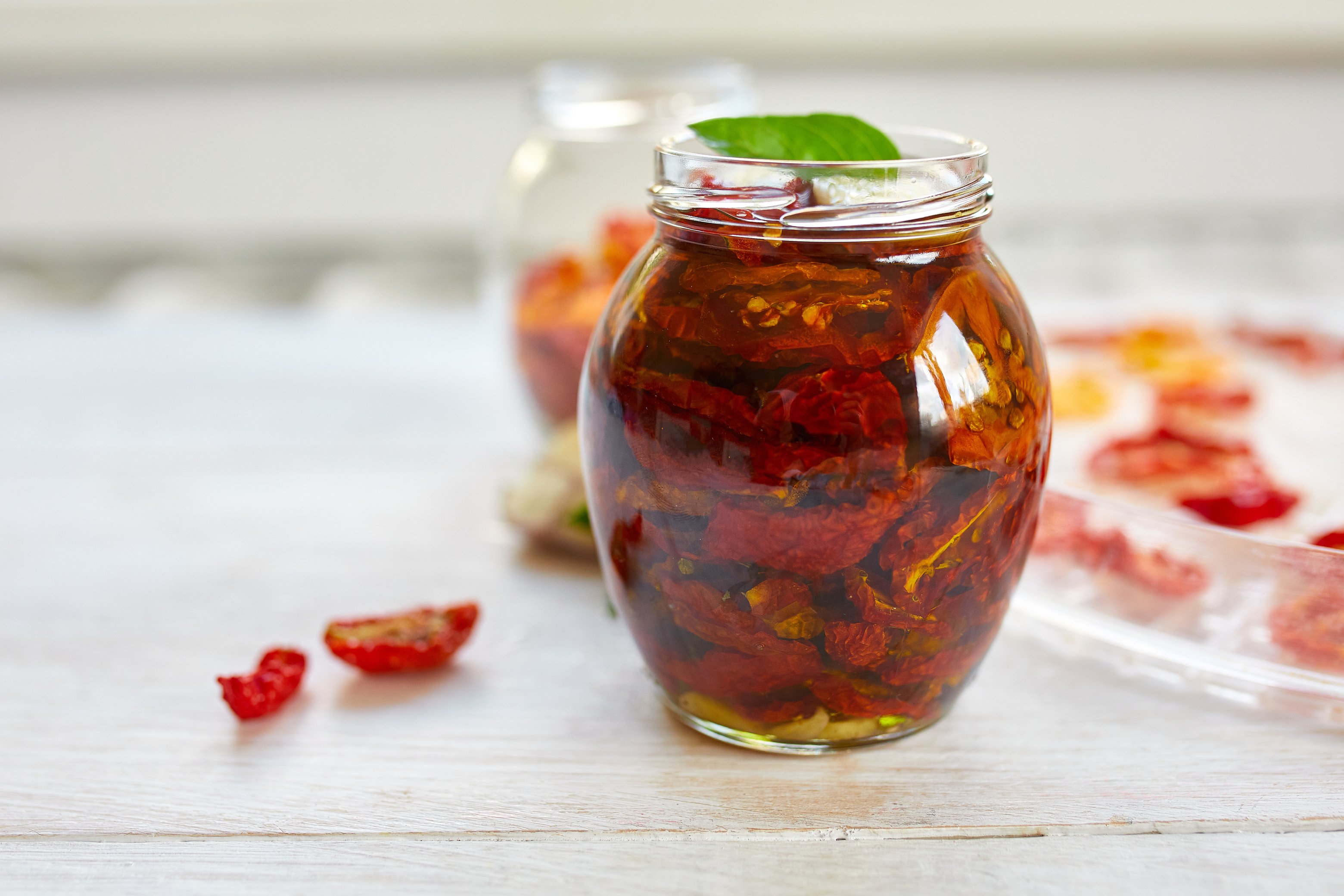 Homemade Sun Dried Tomatoes with Herbs and Garlic in a Jar